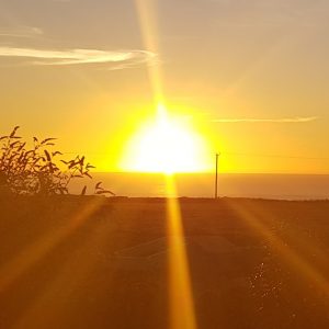 Sun setting over the sea in Cornwall
